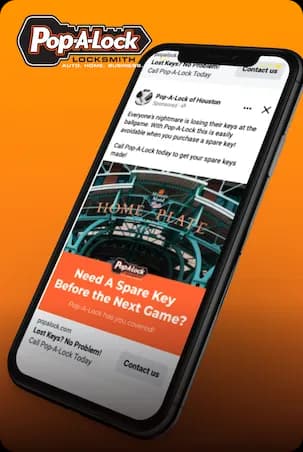 Pop-A-Lock sponsored Facebook ad on a phone over an orange backdrop