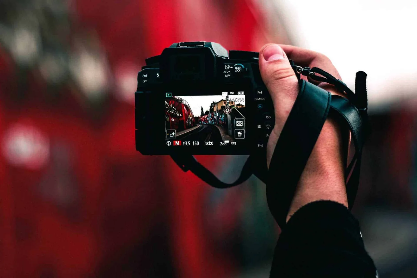 man holding camera taking photo
