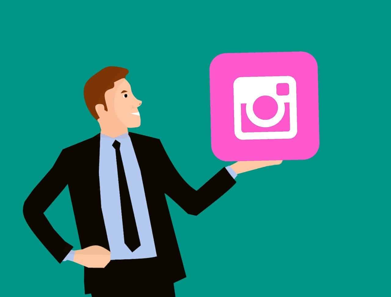 A man in a suit holding the instagram logo