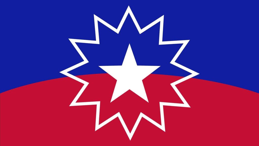 The rectangular Juneteenth flag. It is royal blue and red with a white star in the center surrounded by a a 12 pointed star outline